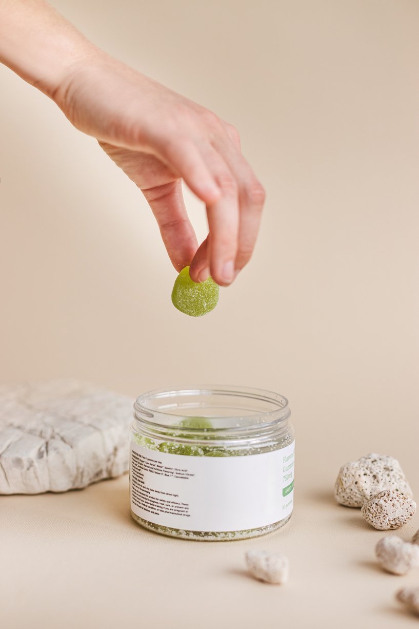 A Person Holding a Green Gummy